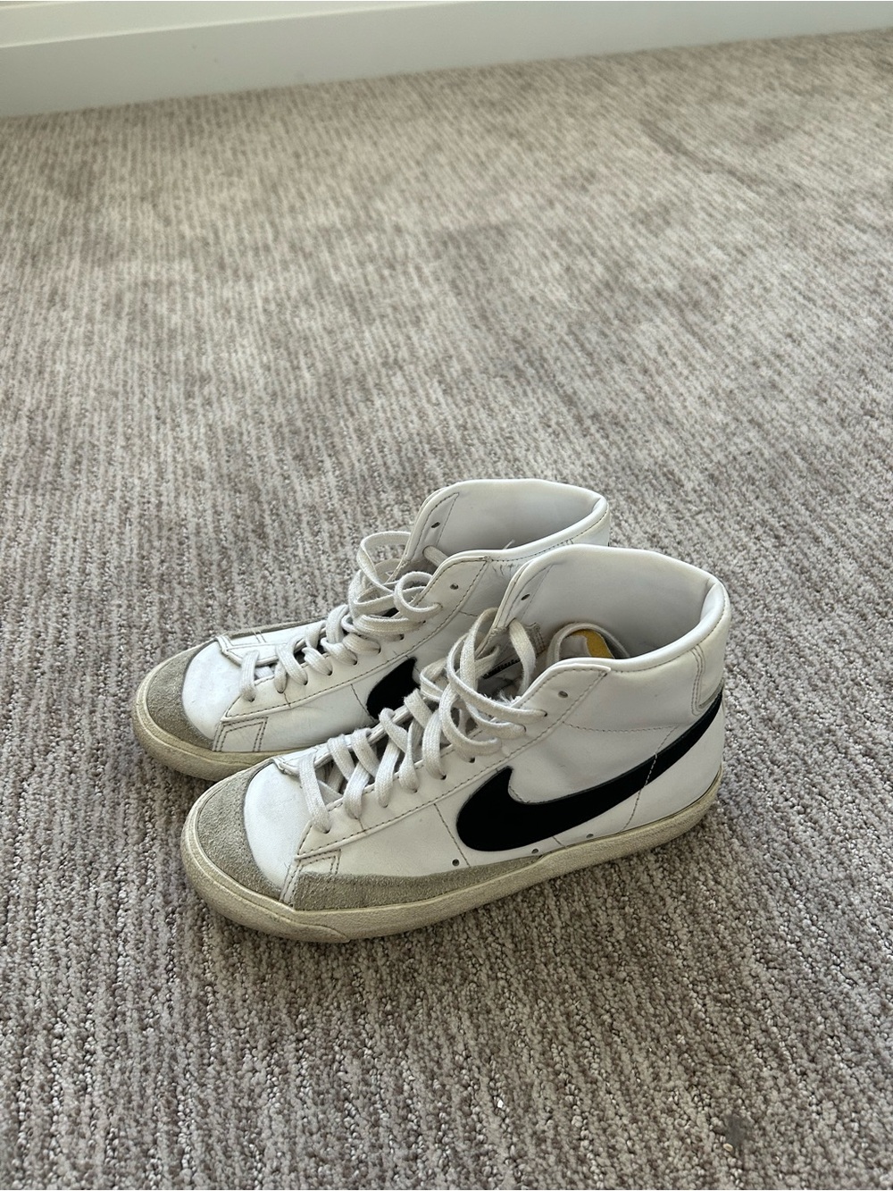 Nike White High-Top Sneakers with Black Swoosh